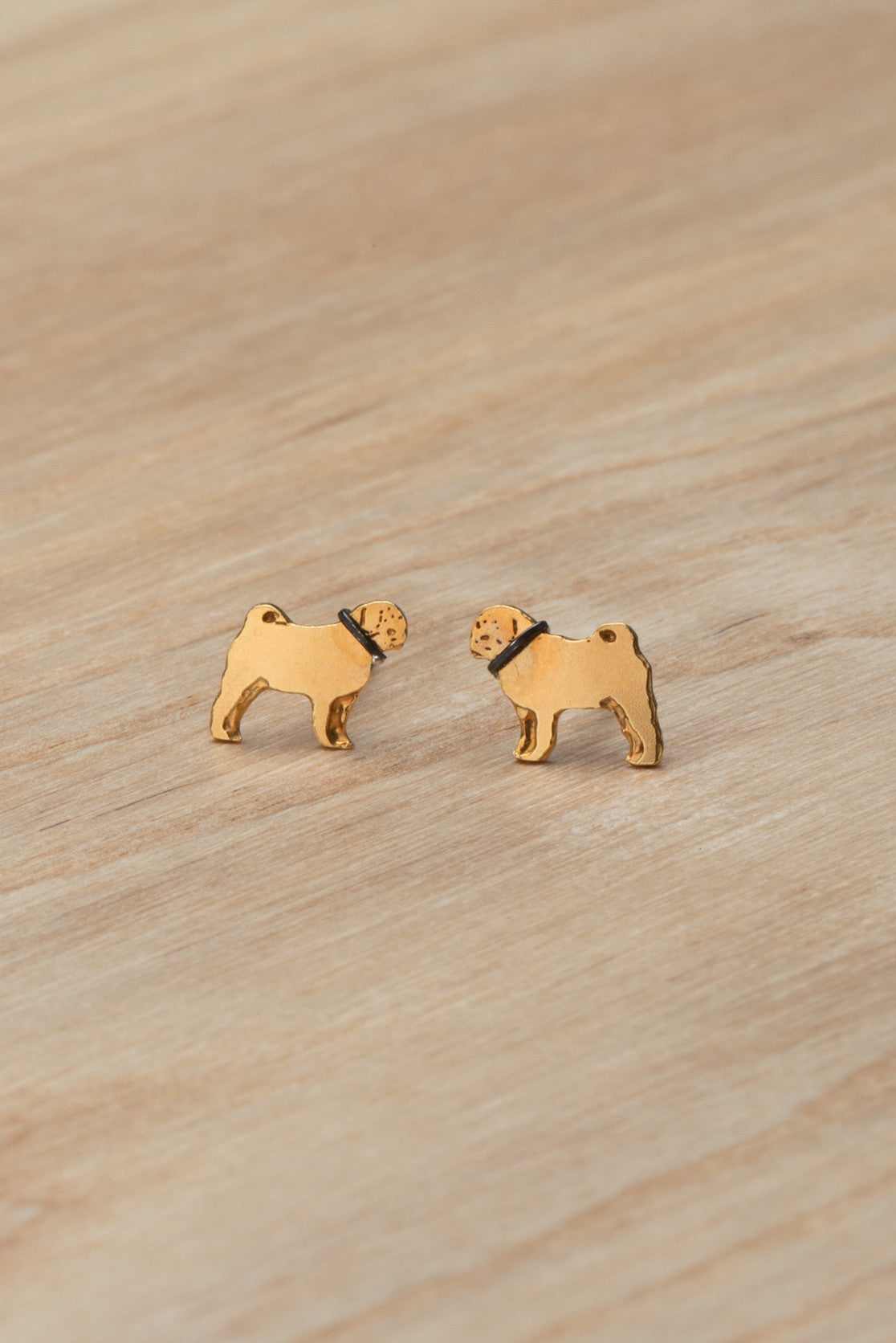 gold pug stud earrings with contrasting black collar