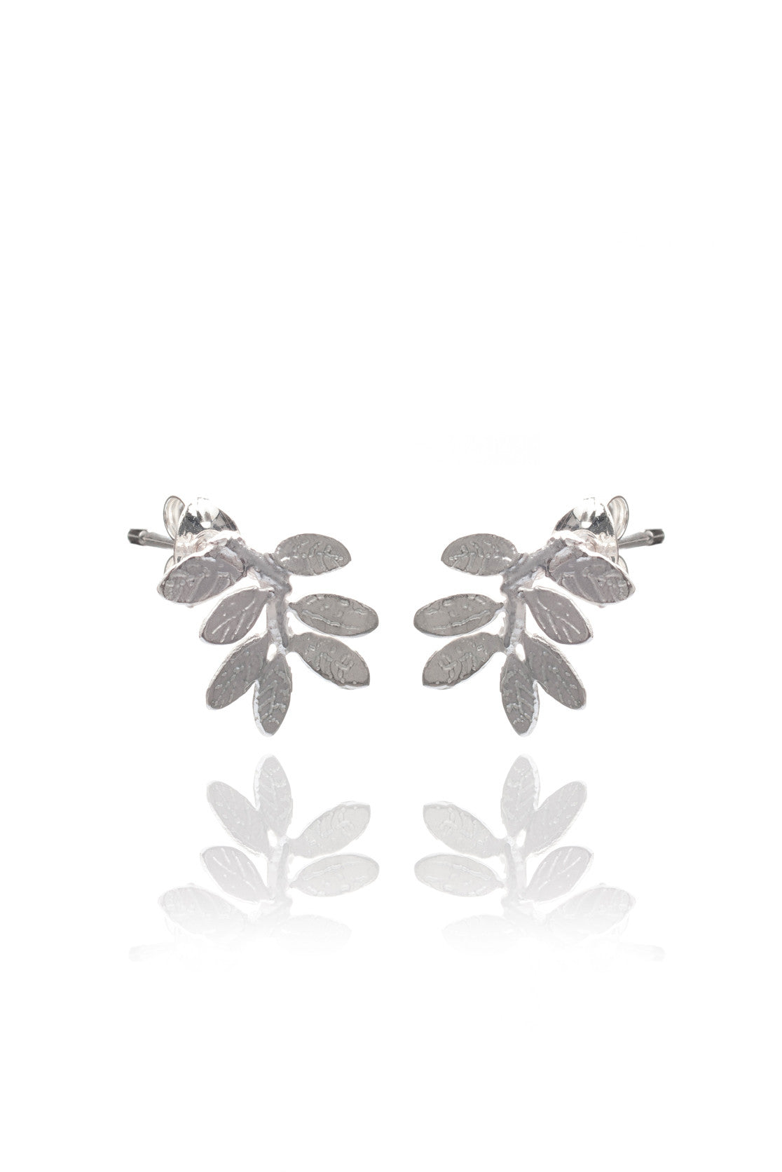 Nature-inspired leaf stud earrings in silver on a white background
