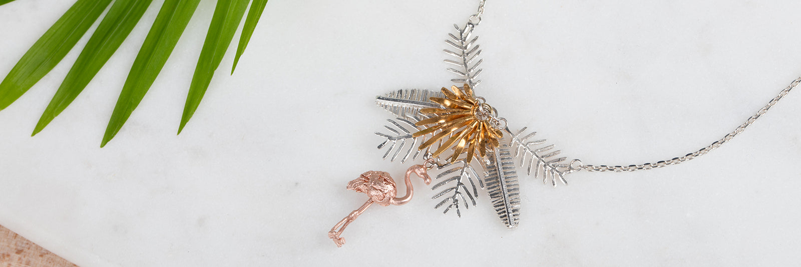 tropical jewellery with flamingos, pineapples and palm leaves