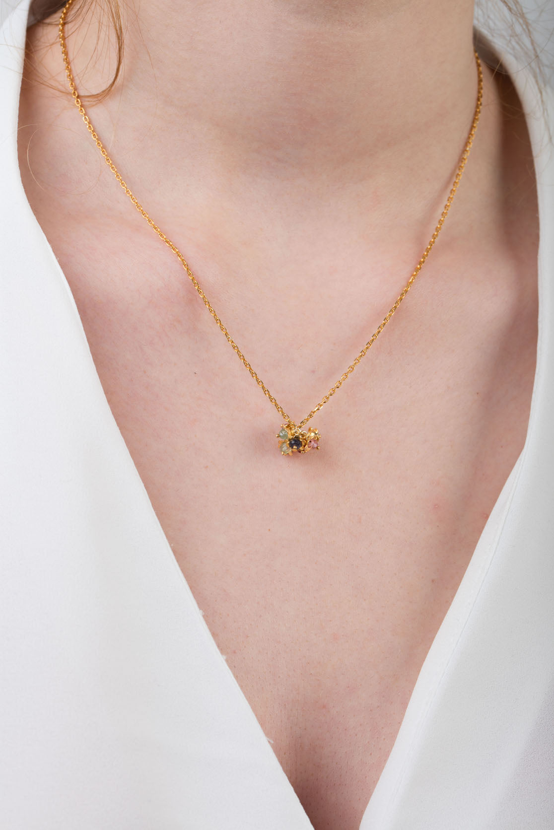 Flower pendant necklace being worn