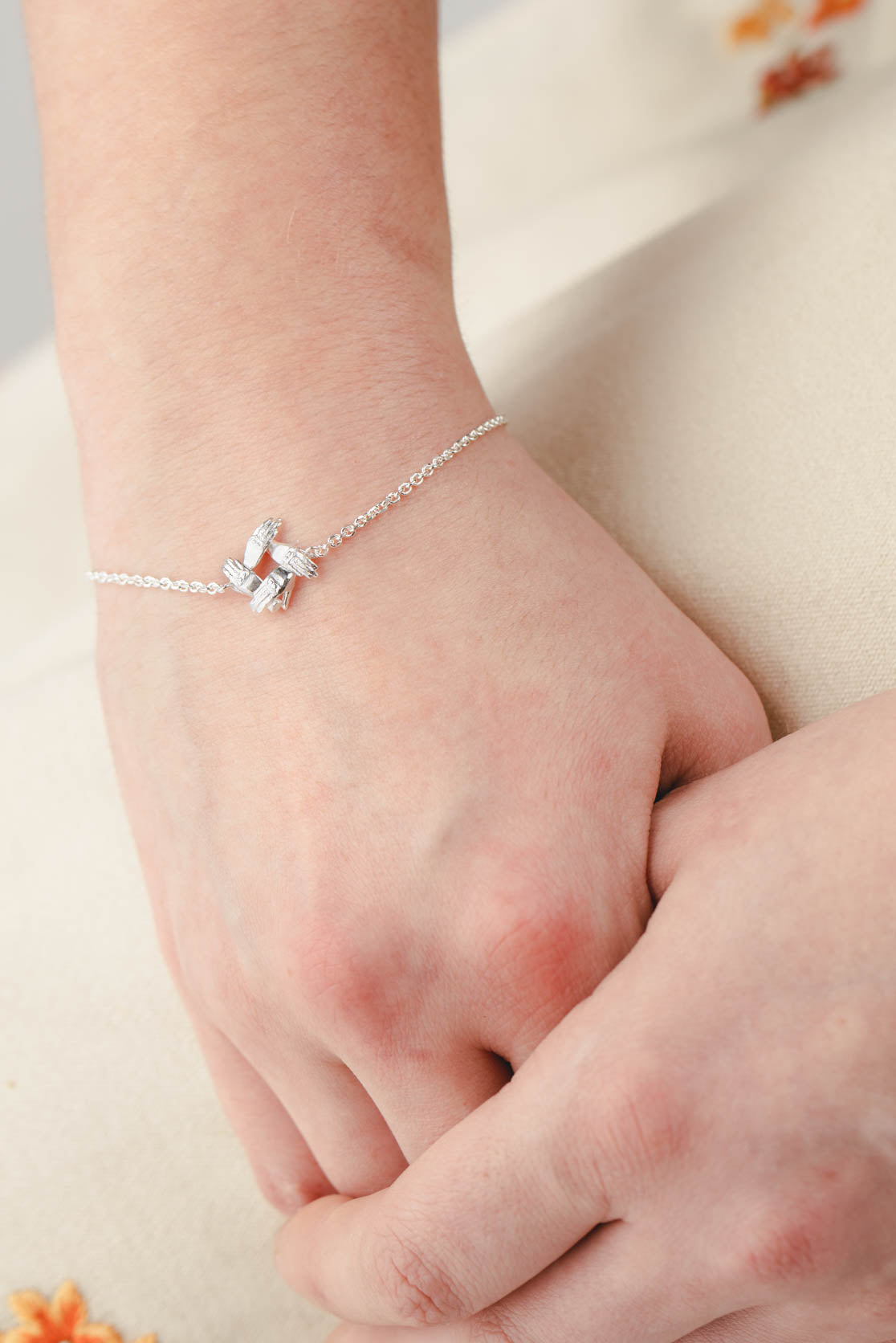 Four Supporting Hands Bracelet