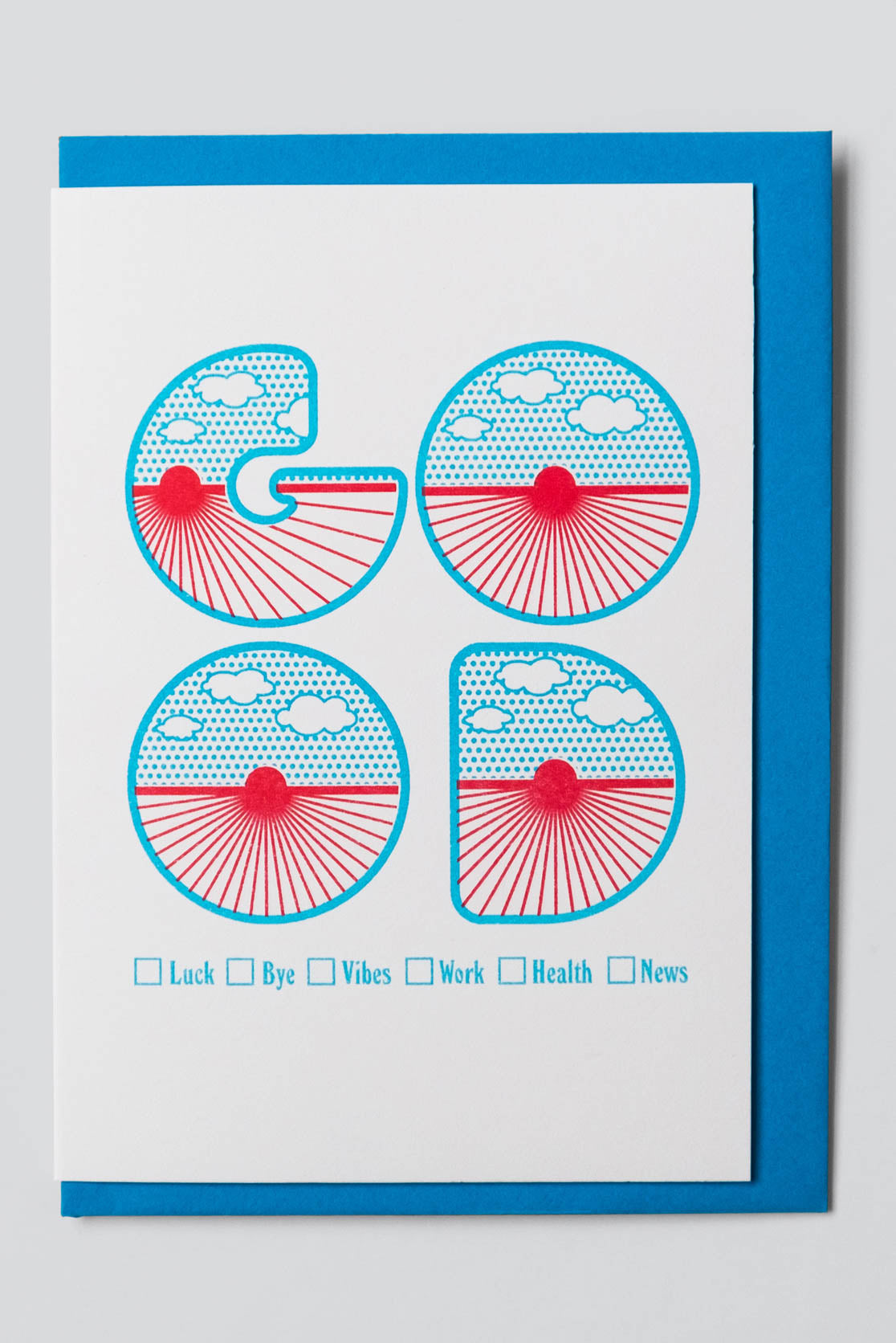 White greeting card with blue 'good' lettering 