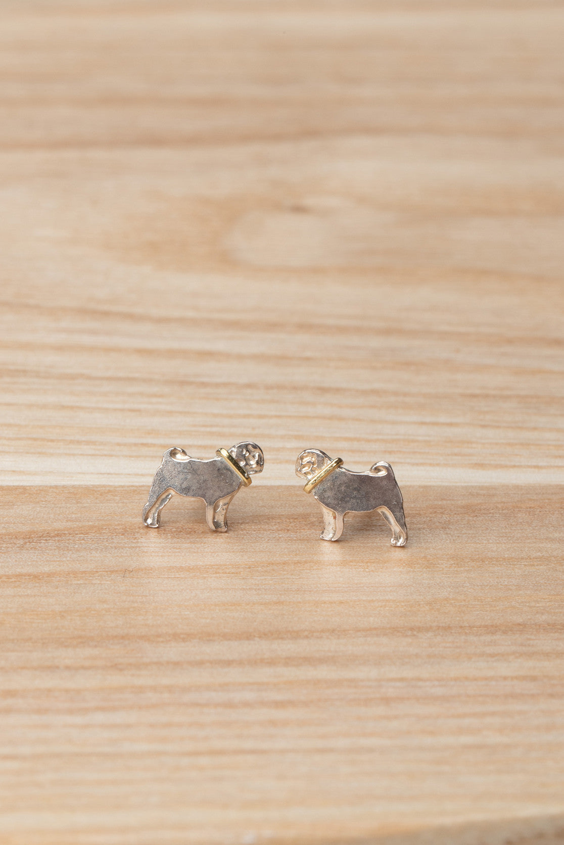 Sterling silver pug stud earrings with contrasting gold collar