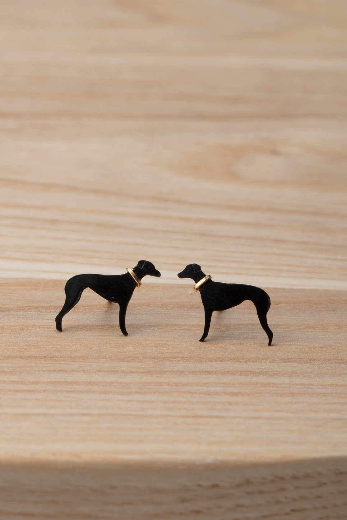 Greyhound stud earrings in black ruthenium plate, with contrasting gold collar.
