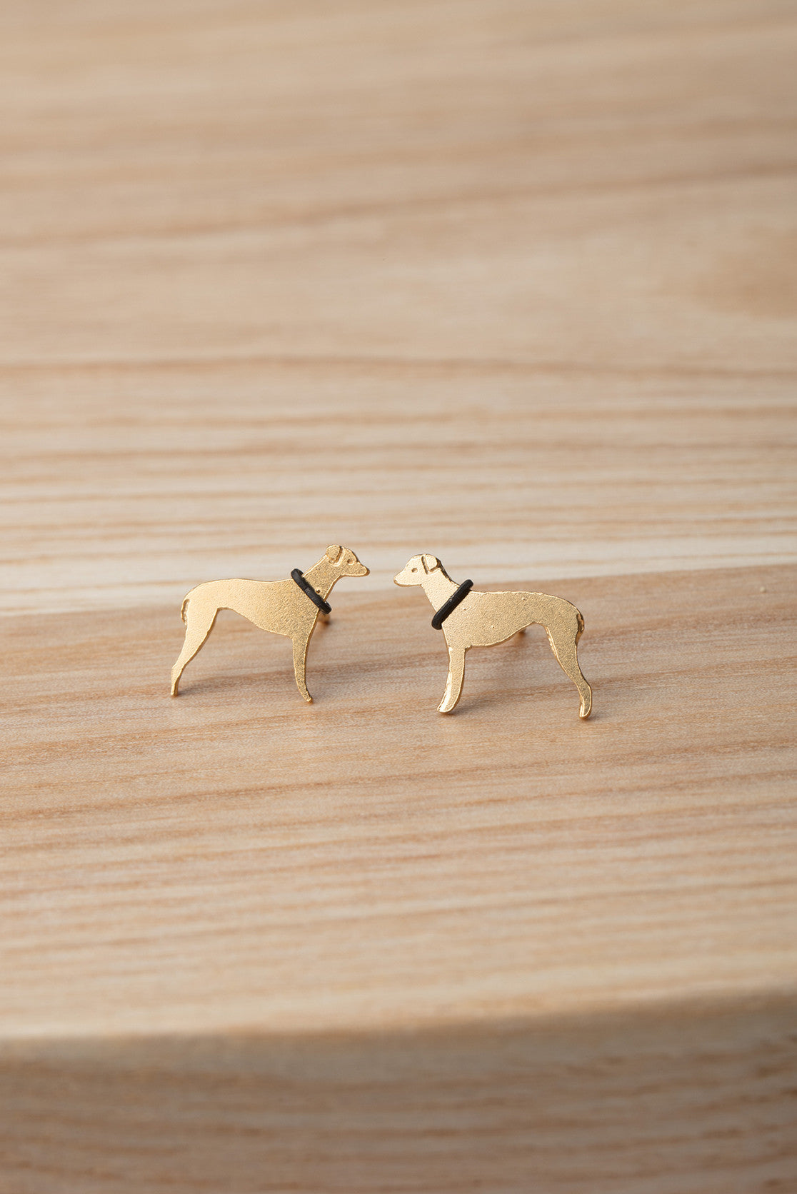 Gold plated greyhound stud earrings with contrasting black collar. 
