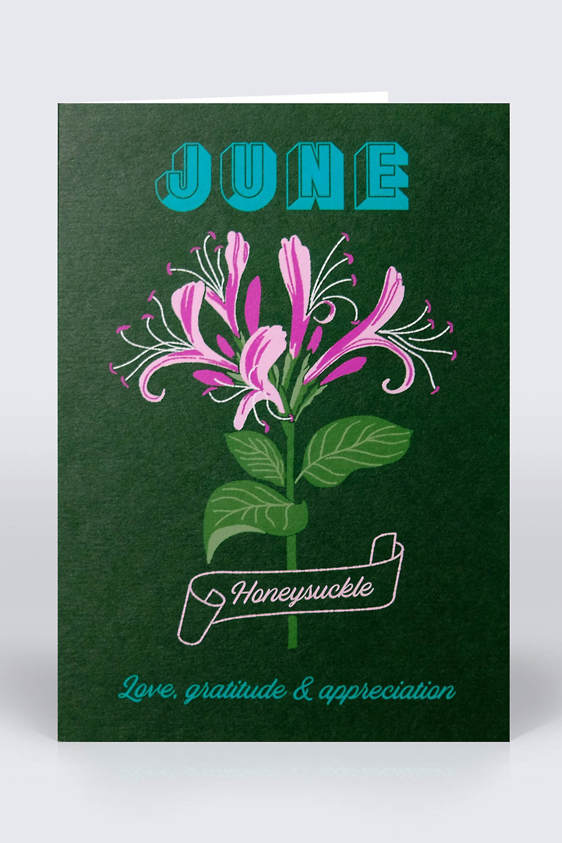 Dark green June birthday card with honeysuckle flowers on the front cover
