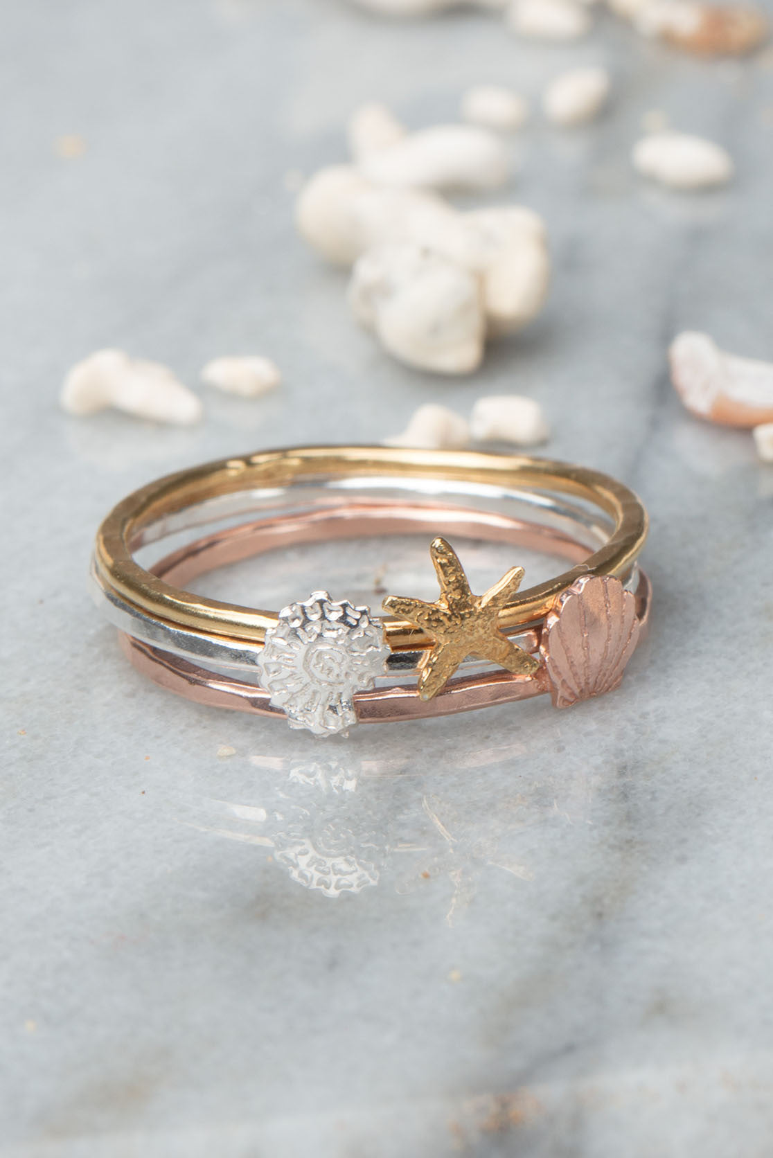 Three Ring Set with gold vermeil starfish ring, a silver nautical ring and a rose gold clamshell ring