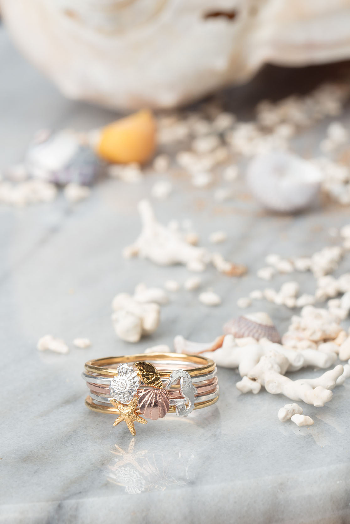 Stacked gold ring with sea creatures and shells