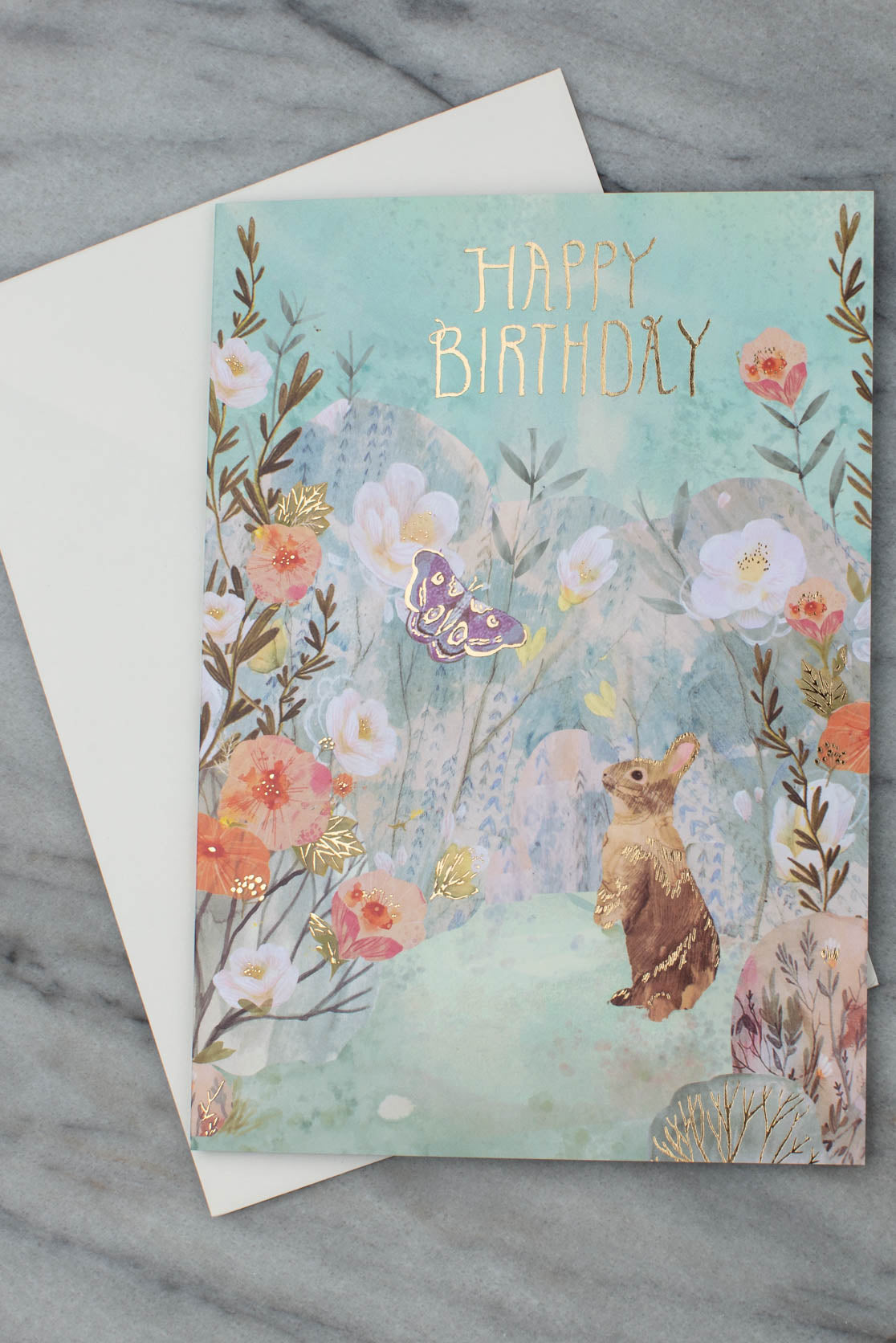 Bunny and flowers birthday card with white envelope
