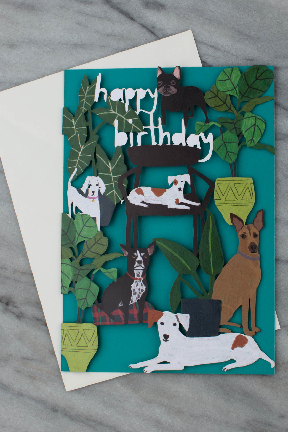 Laser cut happy birthday card with dogs and plants on the front cover