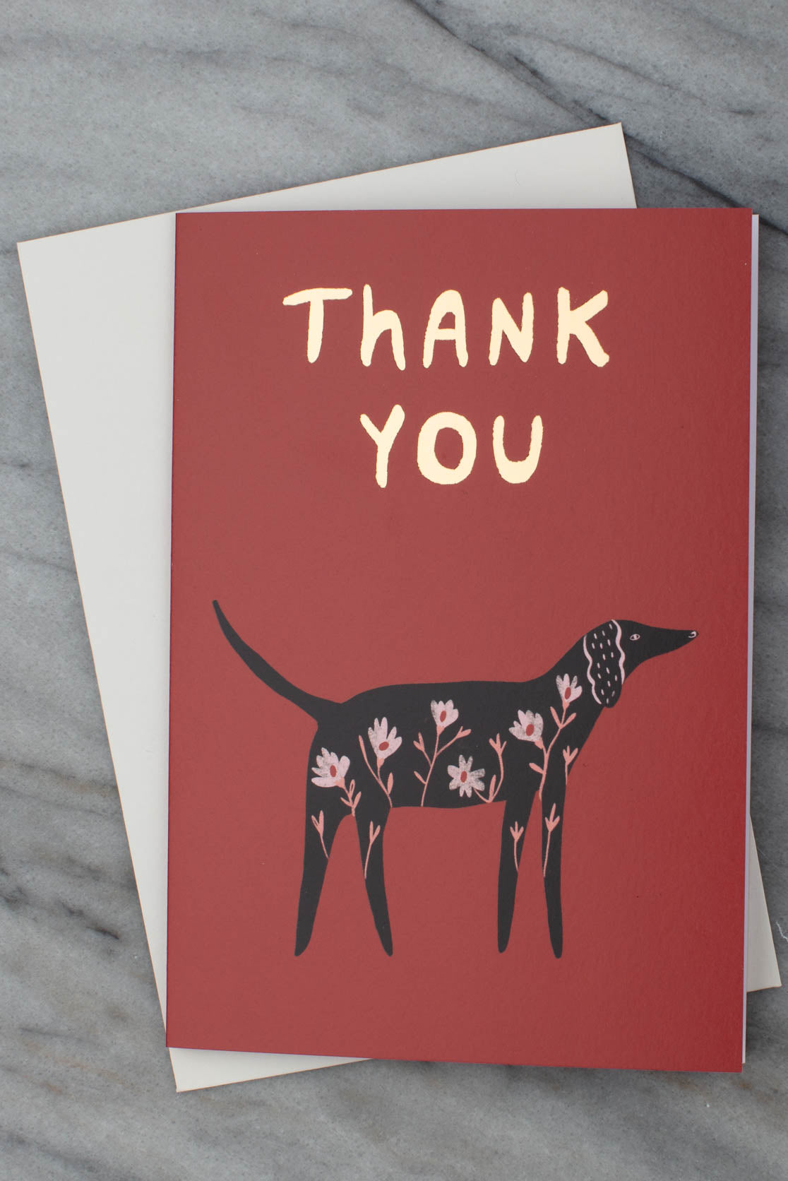 Thank you card in red with a white envelope