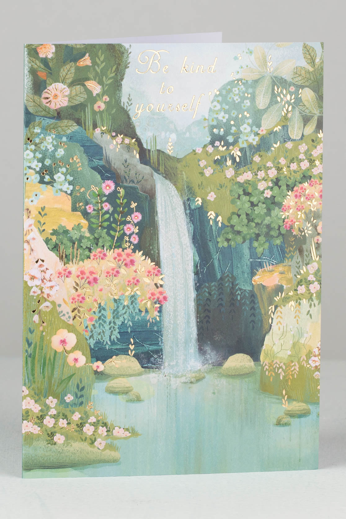 Greetings card with waterfall and flowers on front cover